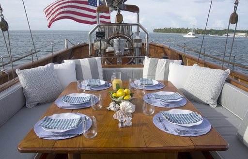 alfresco dining table on the deck of sailing yacht EROS
