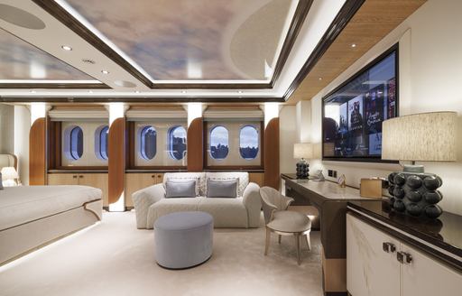 Facilities in the master cabin onboard charter yacht AHPO, sofa in the background with a dressing table and mirror adjacent