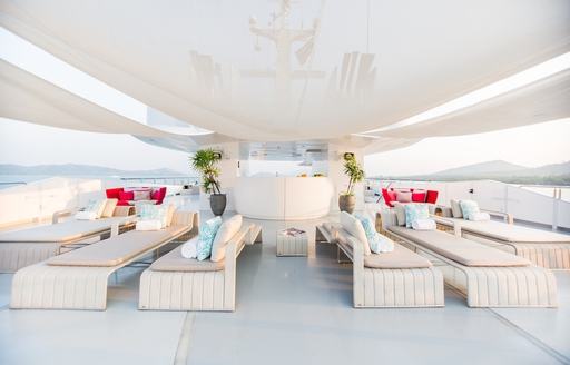 ample lounging options on the chic sundeck aboard motor yacht SALUZI