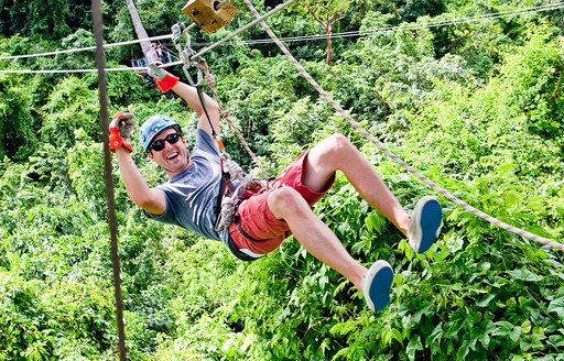 man enjoying Antigua Rainforest Zip Line Tour