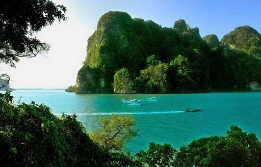 Vessels in the waters surrounding Ao Phang-Nga National Park, Thailand