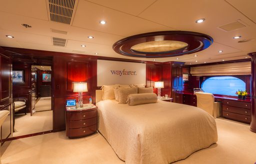 large bed in classically styled master suite on board charter yacht Lady Joy 