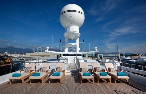 sun loungers lined up on sundeck of luxury yacht double down