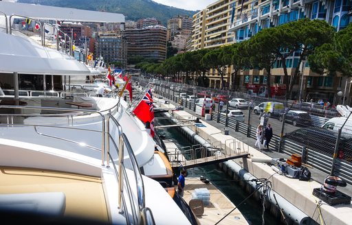 Aft decks of the yachts lined up opposite the Monaco Grand Prix
