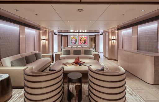 Armchairs, table and comfortable sofa on superyacht SOLEMATES