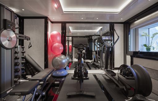 Overview of a fully equipped gym onboard charter yacht Silver Angel