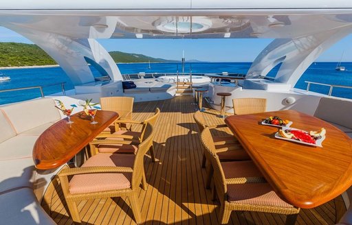 alfresco dining on sundeck of motor yacht agram