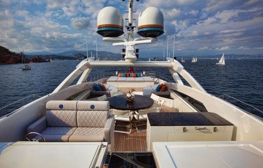 well equipped sundeck with lounging, dining and sunning opportunities on board luxury yacht AURELIA