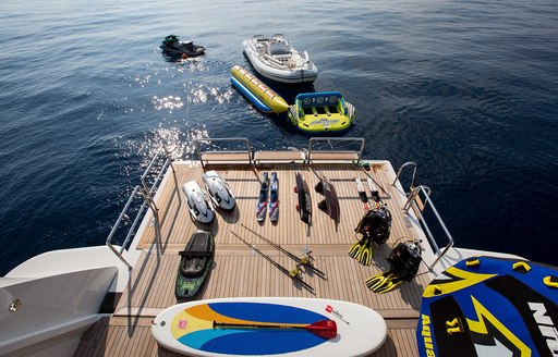 Aerial view of water toys laid out on swimming platform of luxury yacht silver angel 