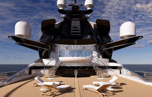 Sun deck onboard charter yacht KISMET with four white padded sun loungers in the foreground