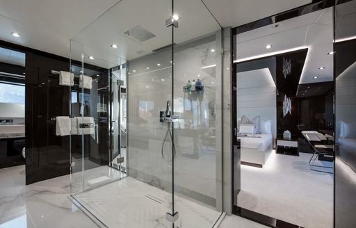 en-suite bathroom with a large shower and marble in the master suite aboard charter yacht Berco Voyager 
