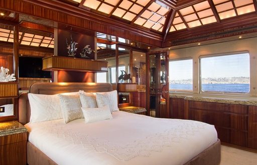 master suite with king sized bed on board luxury yacht TALOS
