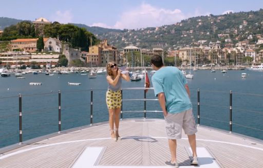 Jennifer Aniston takes picture of Adam Sandler during filming from Netflix film Murder Mystery on board Mediterranean Queen yacht