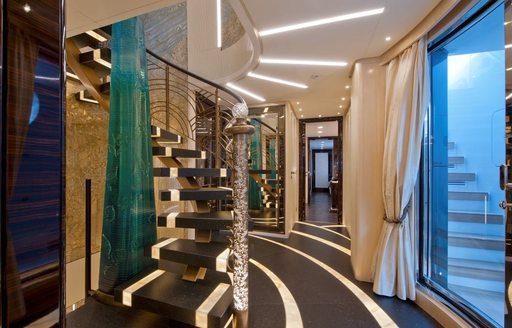 stunning staircase with full-length crystal sculpture on board motor yacht SCORPION