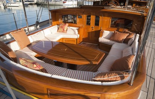owner's cockpit with seating and table on board charter yacht ATHOS 