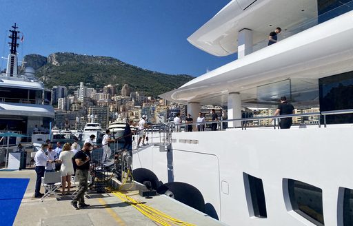 People boarding MY Artefact at the Monaco Yacht Show 2021