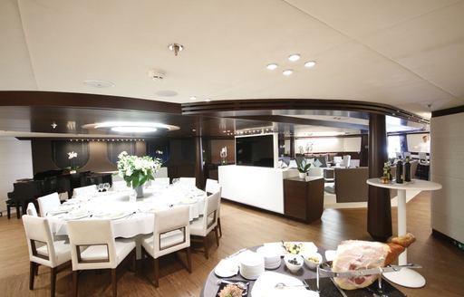 Interior dining and social space on motor yacht KATINA