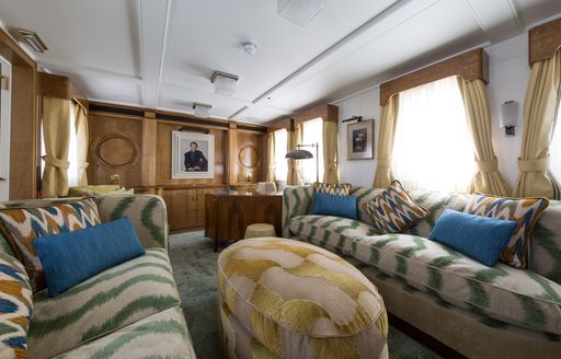 Ivory parchment paneled library on board charter yacht Malahne