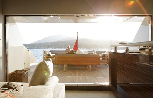 View out to sunkissed main deck of superyacht GEMS II