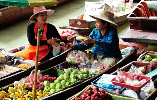 Two Thai women selling food in a floating market, Thailand