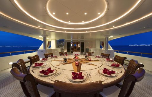 The alfresco dining table on board luxury yacht TOMMY