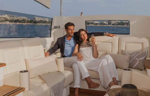 Charter guests leave their superyacht by tender and enjoy the views and some champagne