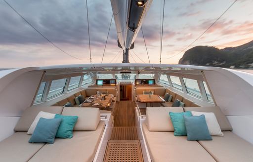 Sunpads and dining areas on board luxury yacht gliss