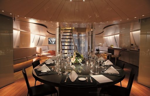 black marble dining table in the main salon of luxury yacht PANTHALASSA 