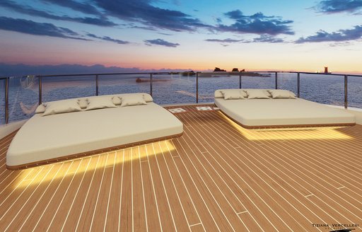 large and accommodating sunpads lining the outer deck of charter yacht scorpion as it cruises through the Mediterranean 
