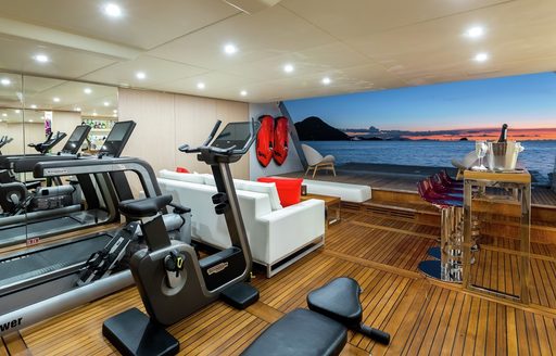 Overview of a gym inside the beach club onboard luxury yacht charter G3