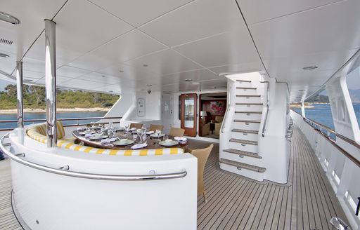 alfresco dining area on main deck aft of luxury yacht CORNELIA 