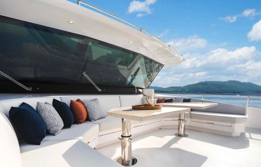 Foredeck alfresco lounge area onboard charter yacht FREEDOM, in front of the bridge