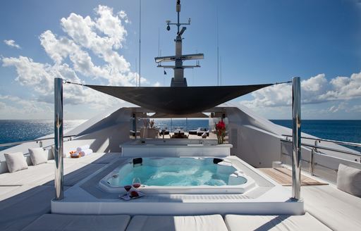 luxury motor yacht IDOL sheltered deck jacuzzi surrounded by comfy seating
