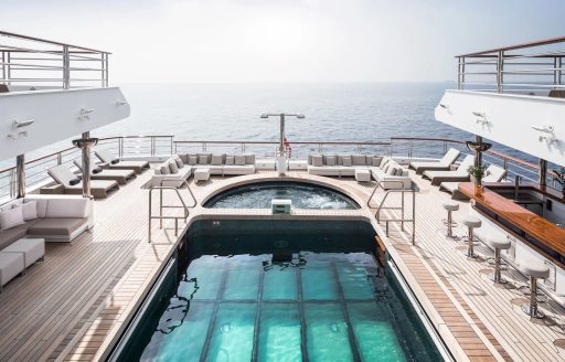 Aft deck swimming pool on board charter yacht OCTOPUS