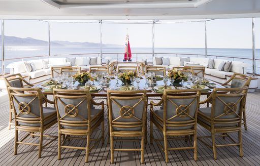 rectangular alfresco dining area on upper deck aft of charter yacht KATHARINE 