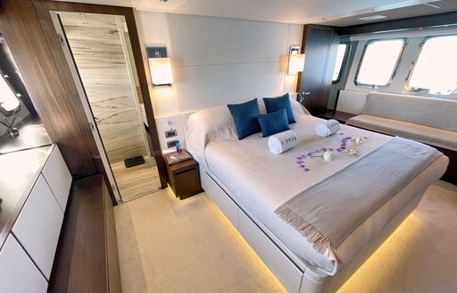 Master cabin onboard charter yacht C-DAZE, central berth facing forward with windows to starboard and access to an ensuite aft