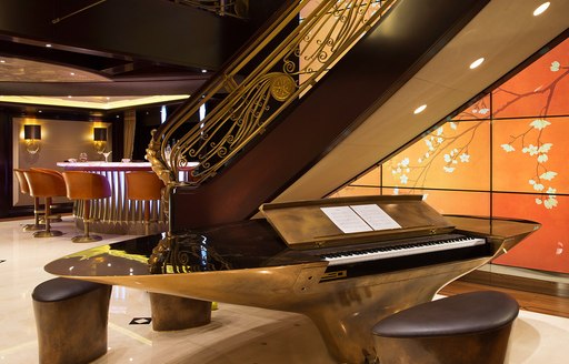 Overview of a piano in the lobby onboard charter yacht WHISPER 