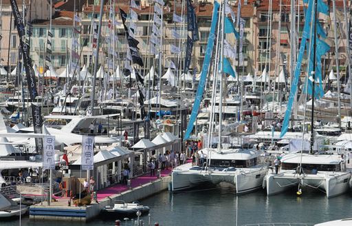 catamarans line up in the Cannes waters for the Cannes Yachting Festival