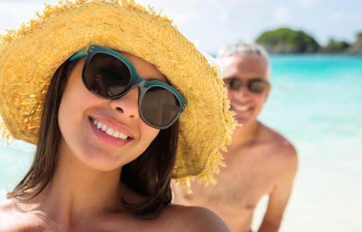 happy couple taking selfie on a bahamas luxury yacht charter holiday