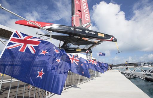 foiling catamaran of Emirates Team New Zealand is lifted into the water in Bermuda