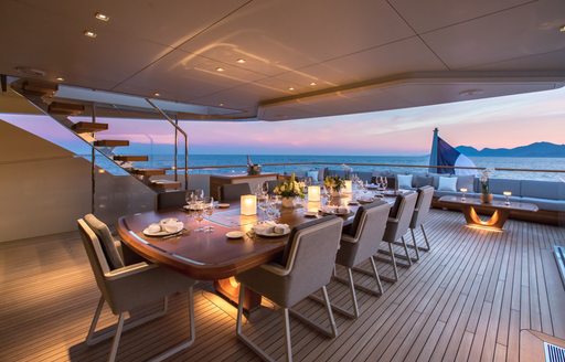 Al fresco dining set up on luxury yacht VERTIGE