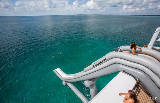 Superyacht DREAM showing off her inflatable slide