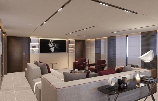 Main salon onboard charter yacht NAIA, L-shaped seating facing a wall-mounted TV