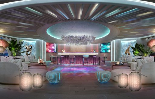 Illuminated dancefloor onboard superyacht charter KISMET, surrounded by plush white seating