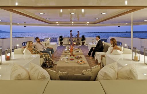 Guests relax on board O'MEGA in the skylounge