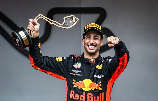 2017 winner of F1 Monaco Grand Prix Daniel Ricciardo standing on podium holding his trophy, driving for Red Bull