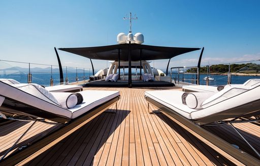 luxe sundeck with chaise loungers aboard motor yacht ELIXIR 