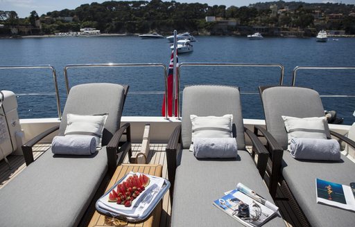 sun loungers lined up on flybridge of luxury yacht PERPETUAL
