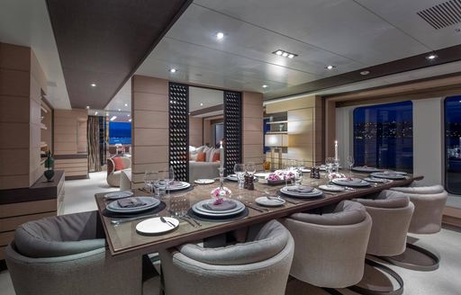 formal dining area in the main salon of charter yacht DYNAR 