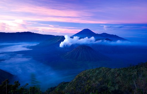 volcanic peaks of Indonesia as the sun sets